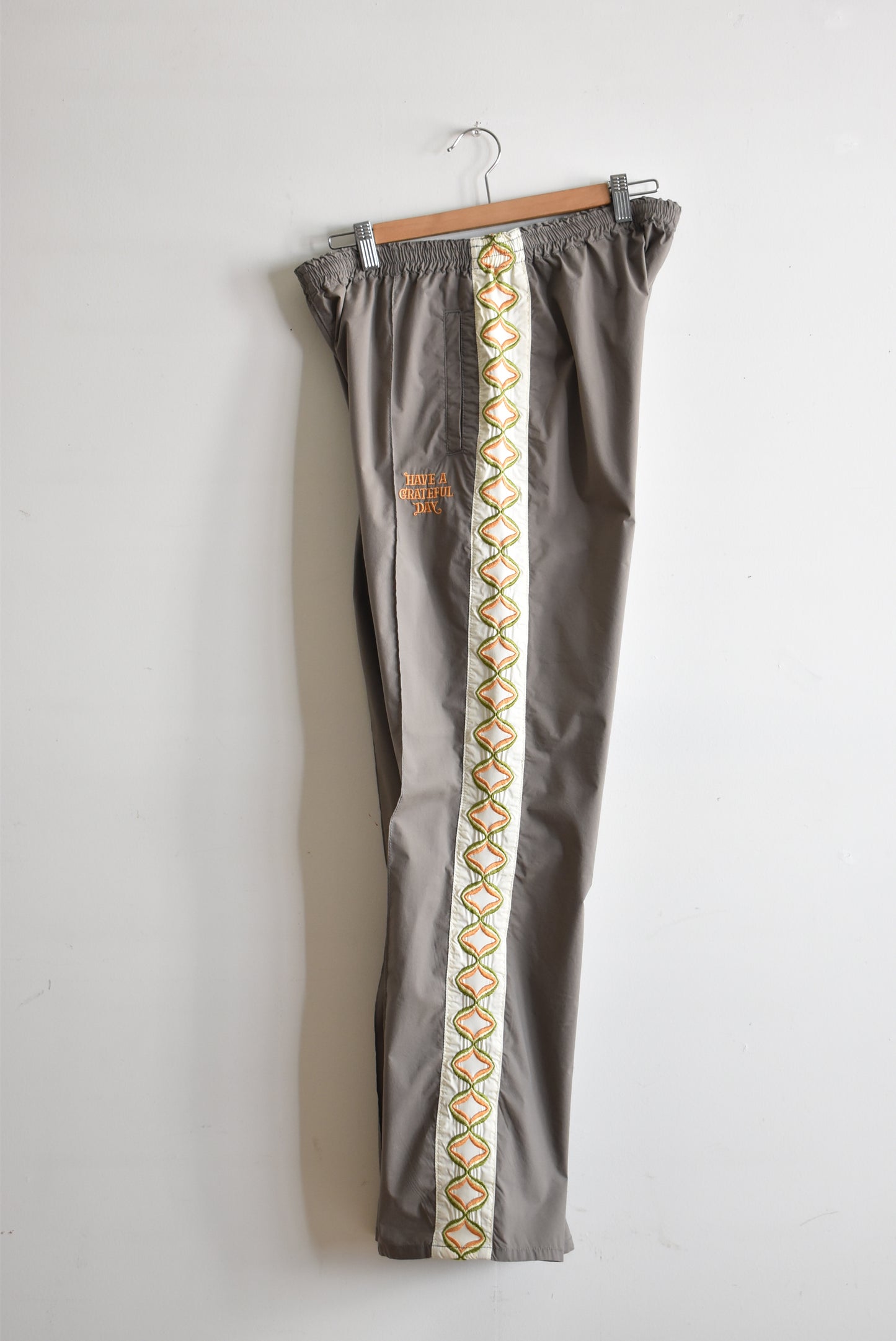 「HAVE A GRATEFUL DAY」tracksuit pants -warm gray-
