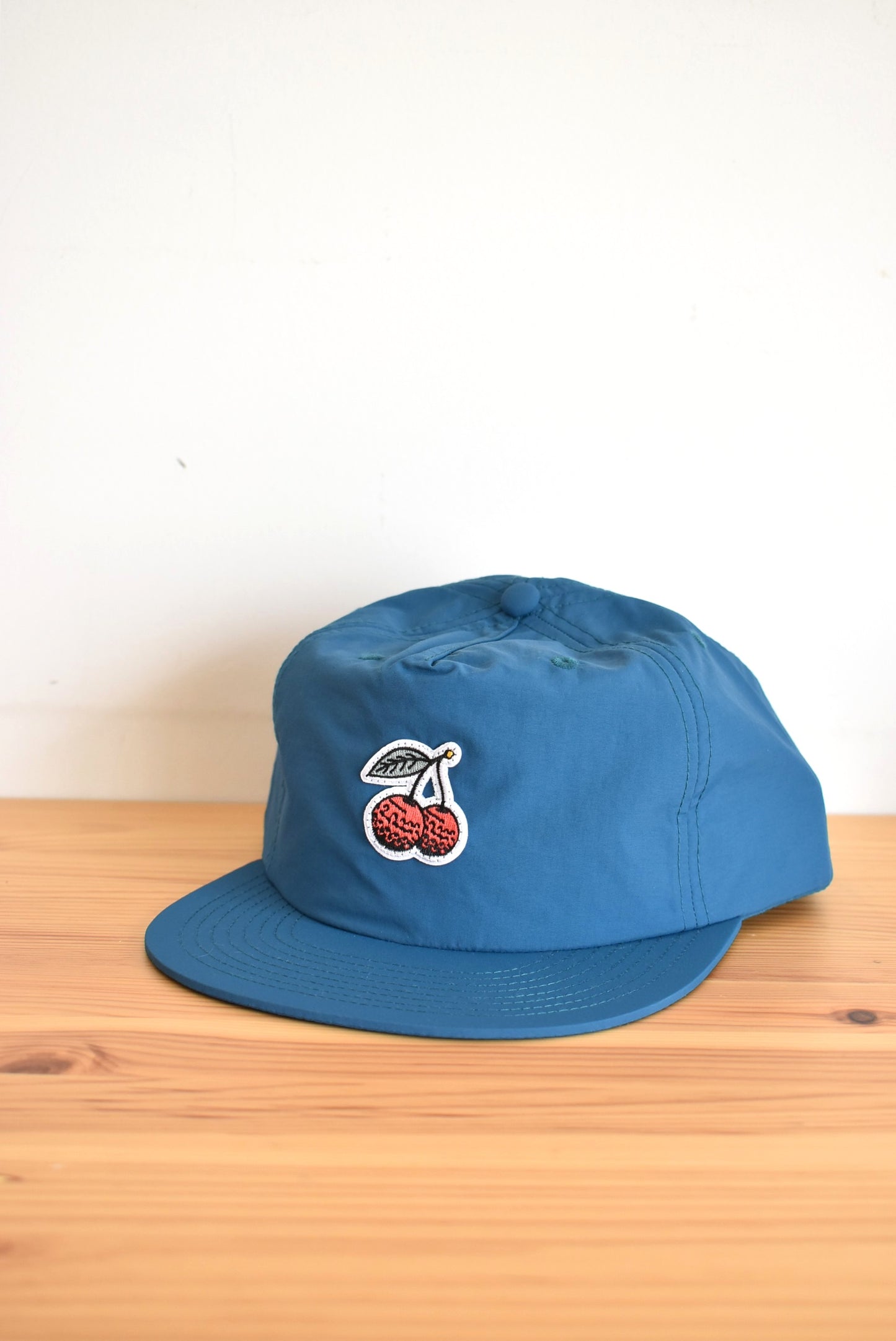 「Outliers Golf」cherrie nylon cap -teal-